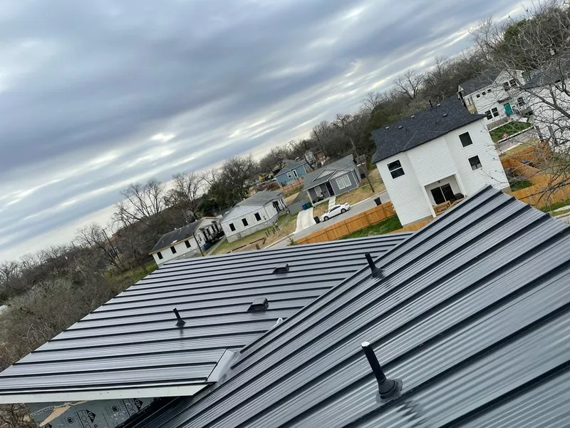 Standing seam metal roof panels with vents for Skylight Repair in Arlington Heights